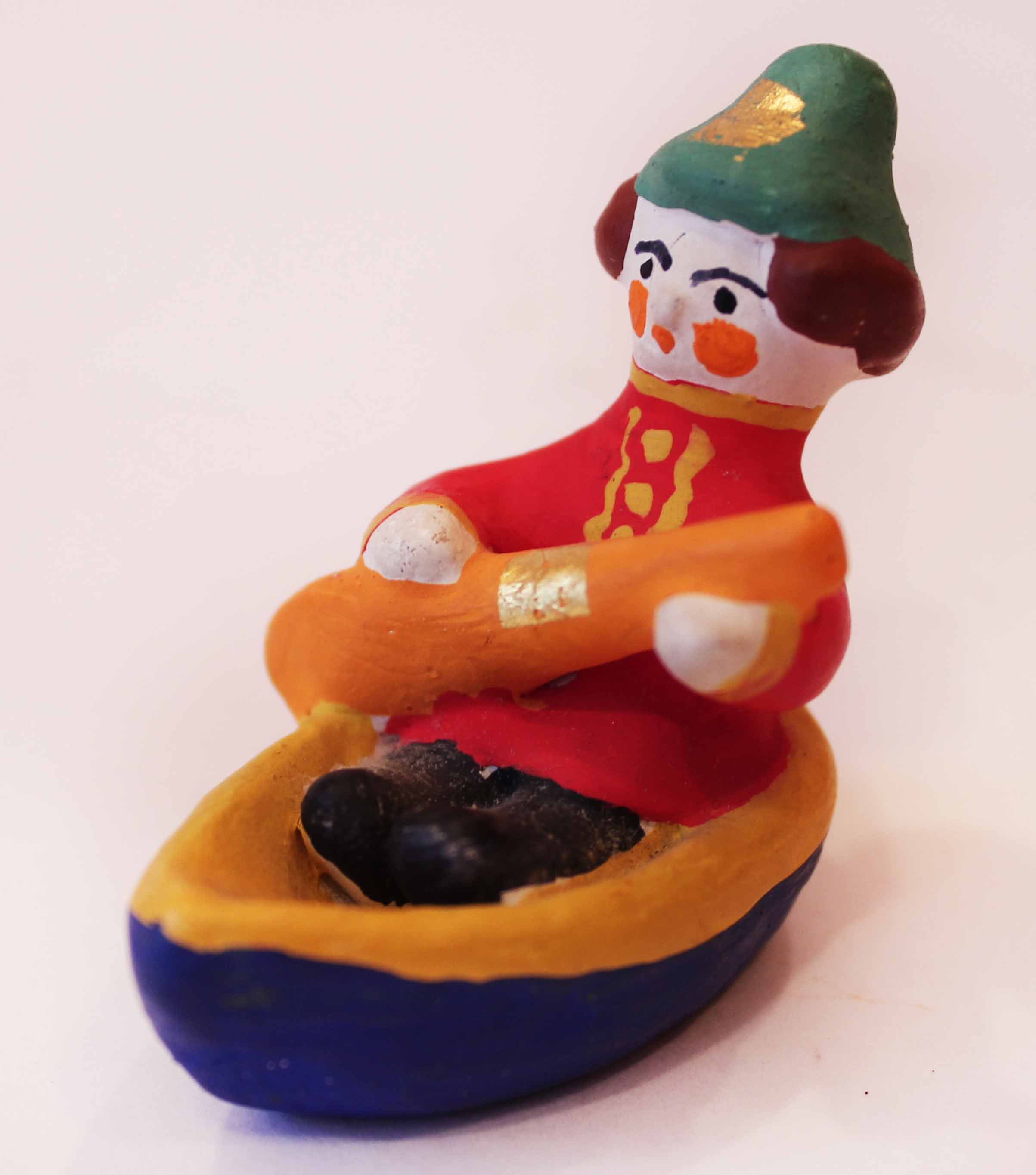 Игрушка \"Мужик в лодке.\"